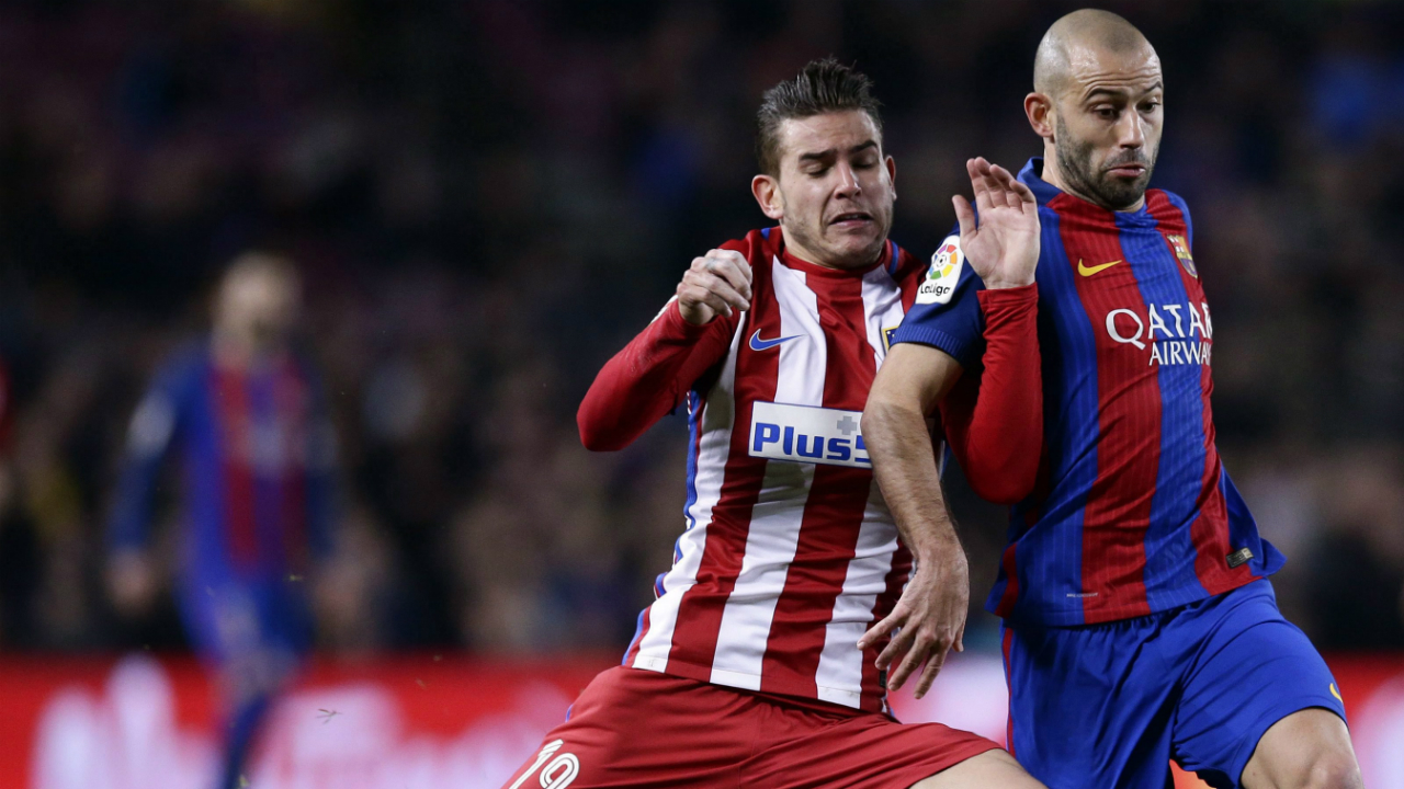 Atletico's-Lucas-Hernandez,-left,-fights-for-the-ball-with-Barcelona's-Javier-Mascherano-during-the-the-Copa-del-Rey-semifinal-second-leg-soccer-match-between-FC-Barcelona-and-Atletico-Madrid-at-the-Camp-Nou-stadium-in-Barcelona,-Spain,-Tuesday-Feb.-7,-2017.-(Manu-Fernandez/AP)