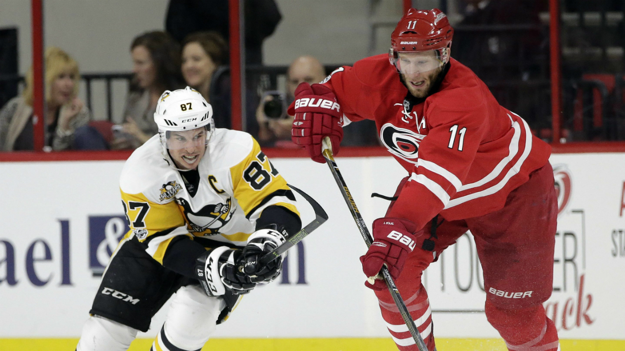 Pittsburgh-Penguins'-Sidney-Crosby-(87)-and-Carolina-Hurricanes'-Jordan-Staal-(11)-chase-the-puck-during-the-second-period-of-an-NHL-hockey-game-in-Raleigh,-N.C.,-Tuesday,-Feb.-21,-2017.-(Gerry-Broome/AP)