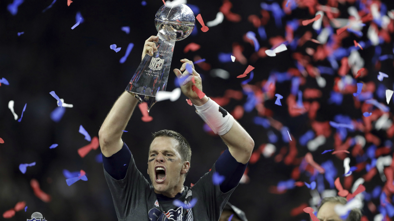 New-England-Patriots'-Tom-Brady-raises-the-Vince-Lombardi-Trophy-after-defeating-the-Atlanta-Falcons-in-overtime-at-the-NFL-Super-Bowl-51-football-game-Sunday,-Feb.-5,-2017,-in-Houston.-The-Patriots-defeated-the-Falcons-34-28.-(Darron-Cummings/AP)