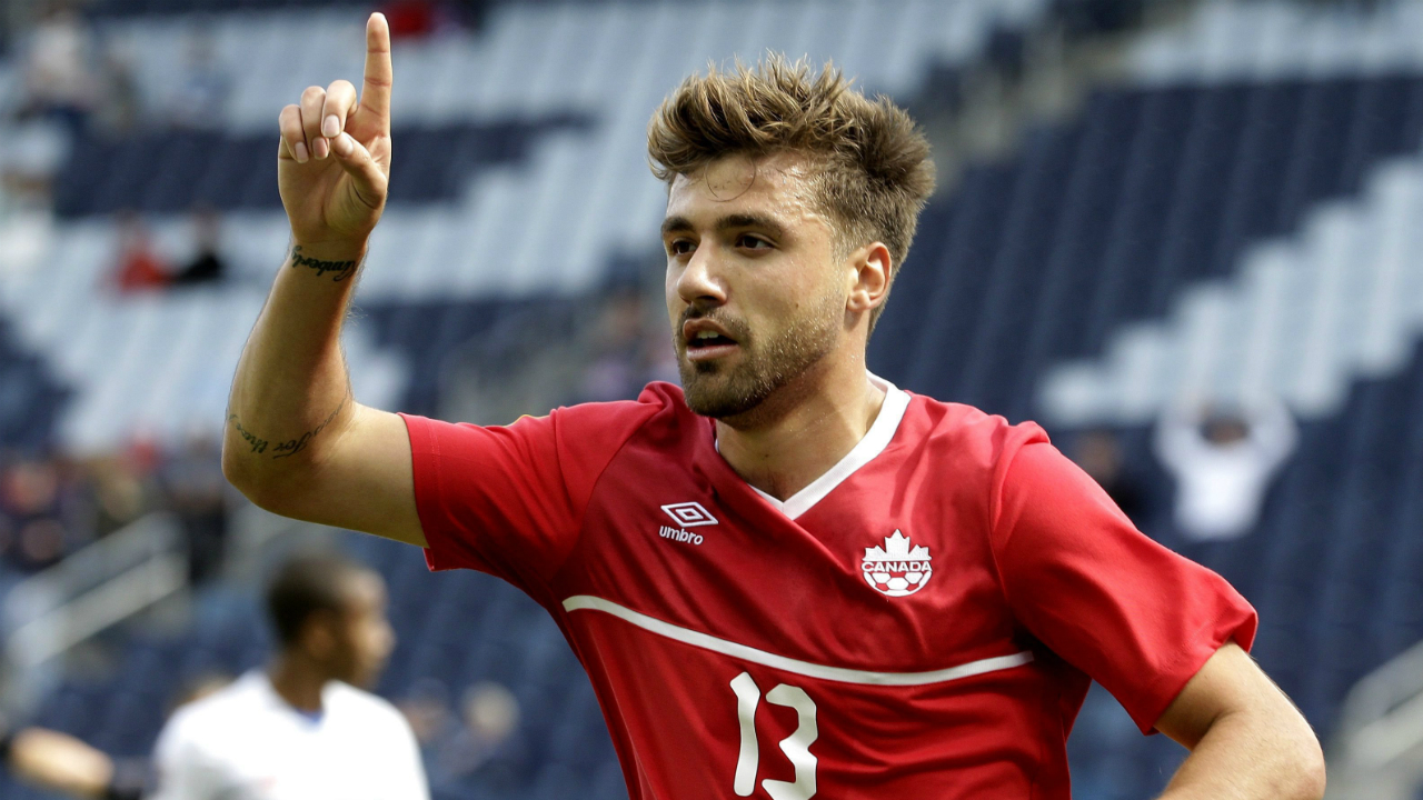 Canada-forward-Michael-Petrasso-celebrates-after-scoring-a-goal.-(Charlie-Riedel/AP)