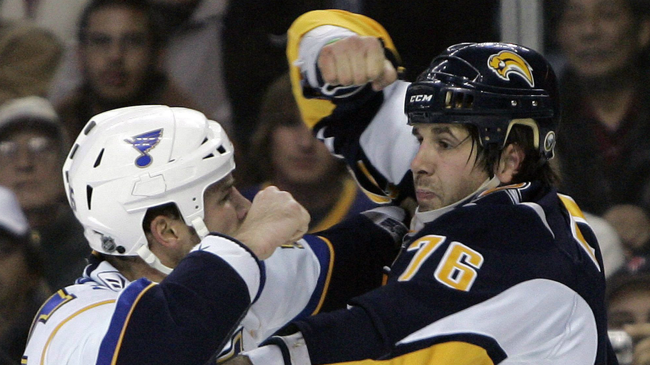 Buffalo-Sabres'-Andrew-Peters-(76)-fights-with-St.-Louis-Blues'-Cam-Janssen-during-the-first-period-of-the-NHL-hockey-game-in-Buffalo,-N.Y.,-Wednesday,-Nov.-12,-2008.-Former-Sabres-player-Peters-won't-face-charges-following-an-on-ice-brawl-involving-the-youth-hockey-team-he-coaches.-(David-Duprey/AP)