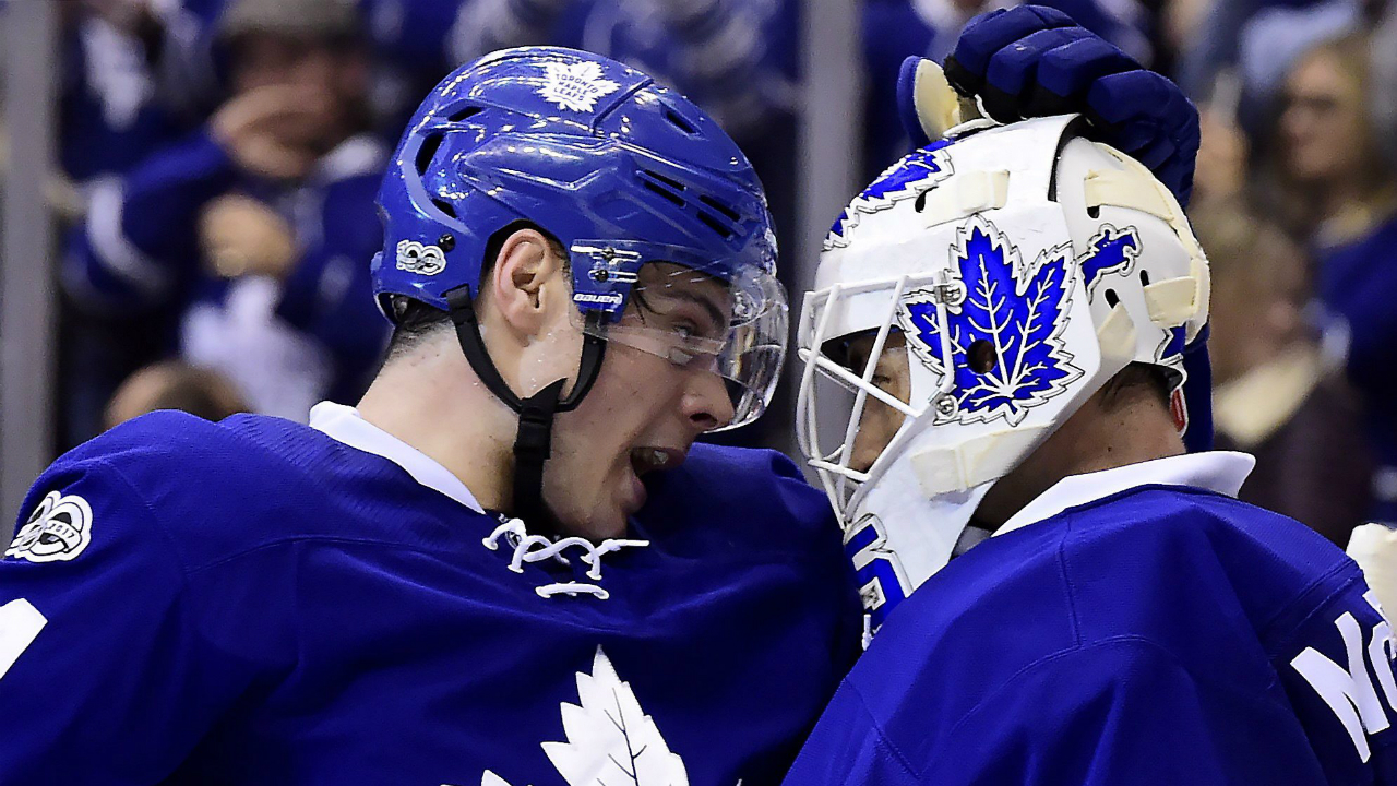 Toronto-Maple-Leafs-centre-Auston-Matthews-(34)-and-Toronto-Maple-Leafs-goalie-Curtis-McElhinney-(35)-celebrate-the-Leafs'-win-following-third-period-NHL-action-against-the-New-Jersey-Devils,-in-Toronto-on-Thursday,-March-23,-2017.-(Frank-Gunn/CP)