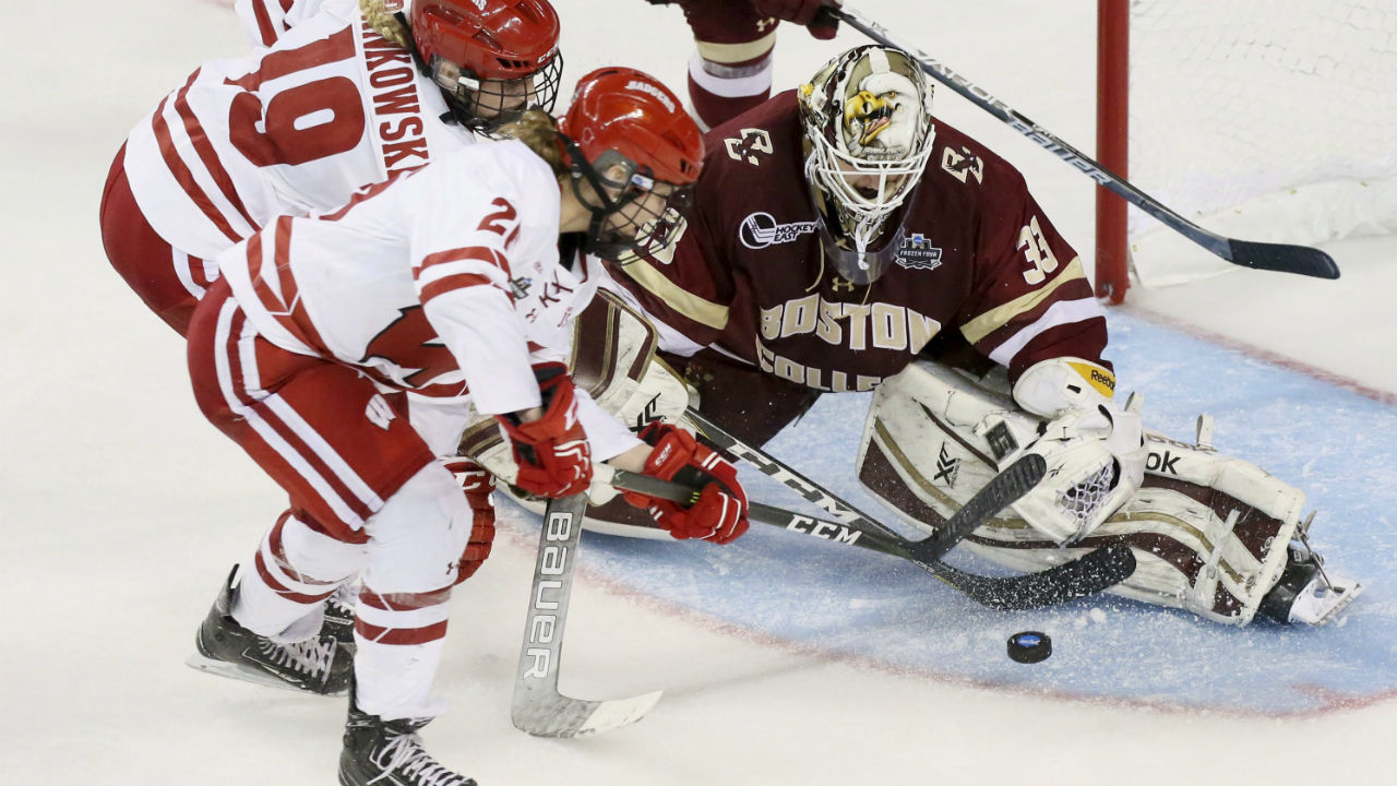 Boston-College-goaltender-Katie-Burt-makes-a-save-while-being-pressured-by-Wisconsin-forwards-Annie-Pankowski-and-Emily-Clark-in-the-third-period-during-a-women's-NCAA-Division-I-Frozen-Four-semifinal-game,-Friday,-March-17,-2017,-at-the-Family-Arena-in-St.-Charles,-Mo.-(Chris-Lee/St.-Louis-Post-Dispatch-via-AP)