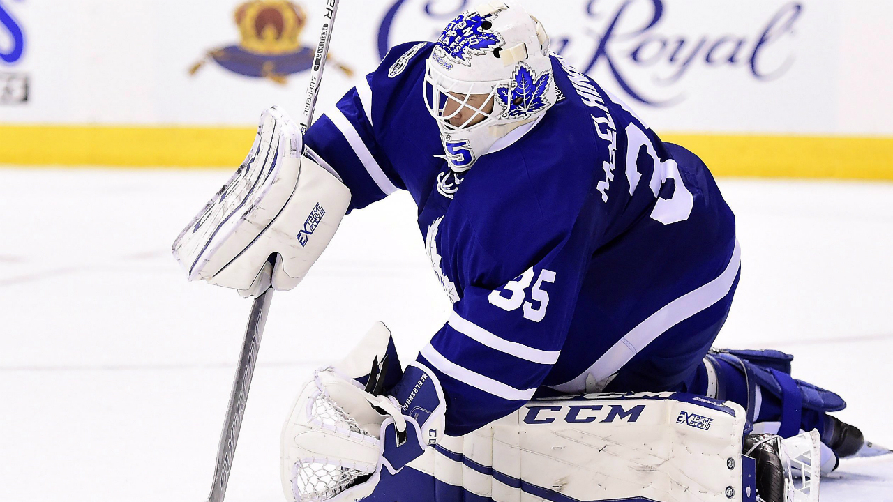 Toronto-Maple-Leafs-goalie-Curtis-McElhinney-(35)-stops-the-puck-during-third-period-NHL-action-against-the-New-Jersey-Devils,-in-Toronto-on-Thursday,-March-23,-2017.-(Frank-Gunn/CP)