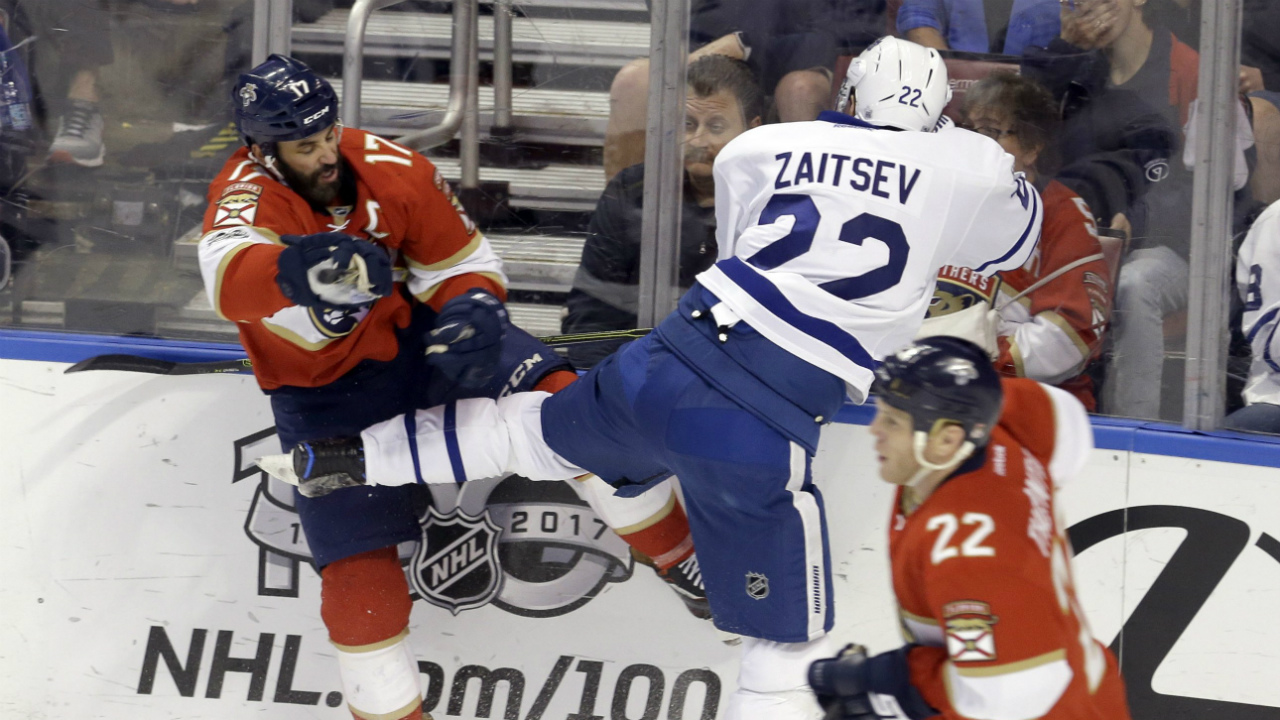 Toronto-Maple-Leafs-defenceman-Nikita-Zaitsev-(22)-checks-Florida-Panthers-centre-Derek-MacKenzie-(17)-in-the-second-period-of-an-NHL-hockey-game,-Tuesday,-March-14,-2017,-in-Sunrise,-Fla.-(Alan-Diaz/AP)