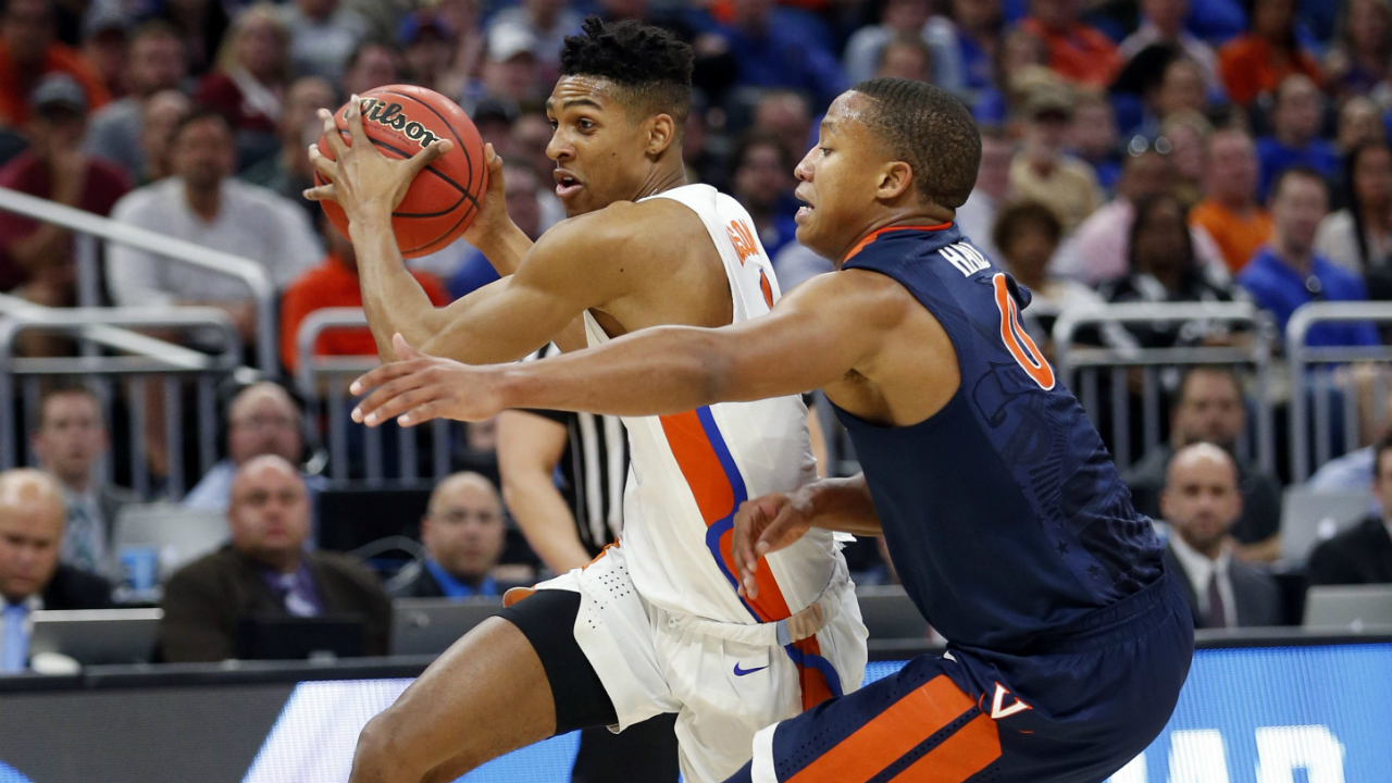 Virginia's-guard-Devon-Hall-(0)-defends-Florida's-forward-Devin-Robinson-(1),-during-the-first-half-of-a-second-round-game-of-the-NCAA-men's-college-basketball-tournament,-Saturday,-March-18,-2017,-in-Orlando,-Fla.-(Wilfredo-Lee/AP)