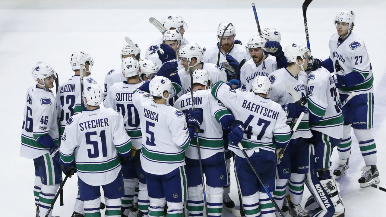 The-Vancouver-Canucks'-celebrates-Daniel-Sedin's-game-winning-goal-in-the-overtime-period-of-an-NHL-hockey-game-against-the-Chicago-Blackhawks-Tuesday,-March-21,-2017,-in-Chicago.-The-Canucks-won-5-4.-(Charles-Rex-Arbogast/AP)