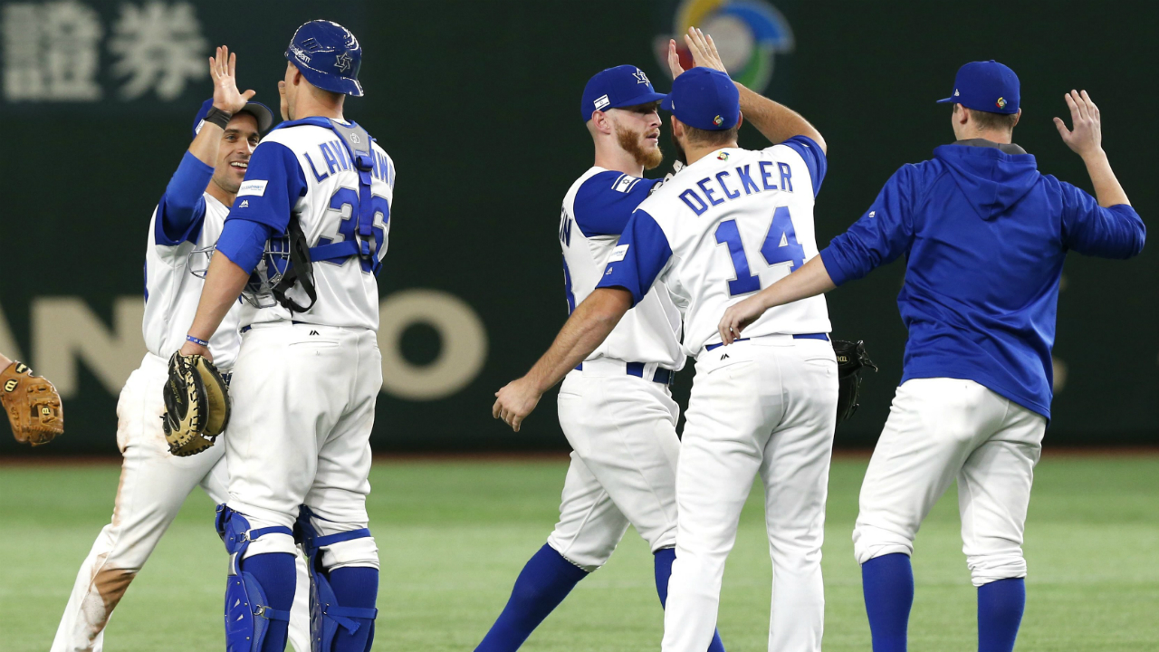 Israel's-catcher-Ryan-Lavarnway-(36)-and-Cody-Decker-(14)-celebrate-with-teammates-after-beating-Cuba-4-1-in-their-second-round-game-of-the-World-Baseball-Classic-at-Tokyo-Dome-in-Tokyo,-Sunday,-March-12,-2017.-(Toru-Takahashi/AP)