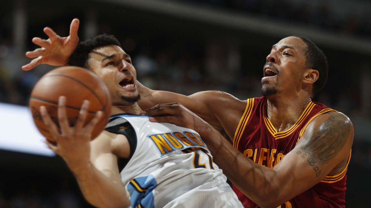 Cleveland-Cavaliers-forward-Channing-Frye,-right,-fouls-Denver-Nuggets-guard-Jamal-Murray-as-he-drives-to-the-rim-in-the-second-half-of-an-NBA-basketball-game-Wednesday,-March-22,-2017,-in-Denver.-The-Nuggets-won-126-113.-(David-Zalubowski/AP)