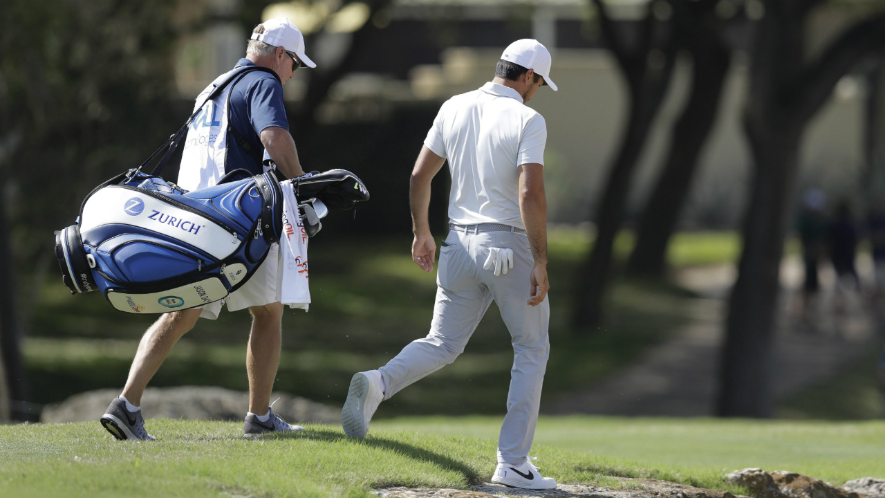 Defending-champion-Jason-Day,-right,-of-Australia,-walks-down-the-seventh-hole-after-he-conceded-to-Pat-Perez-after-six-holes-of-play-during-round-robin-play-at-the-Dell-Technologies-Match-Play-golf-tournament-at-Austin-County-Club,-Wednesday,-March-22,-2017,-in-Austin,-Texas.-Day-also-withdrew-from-the-tournament.-(Eric-Gay/AP)