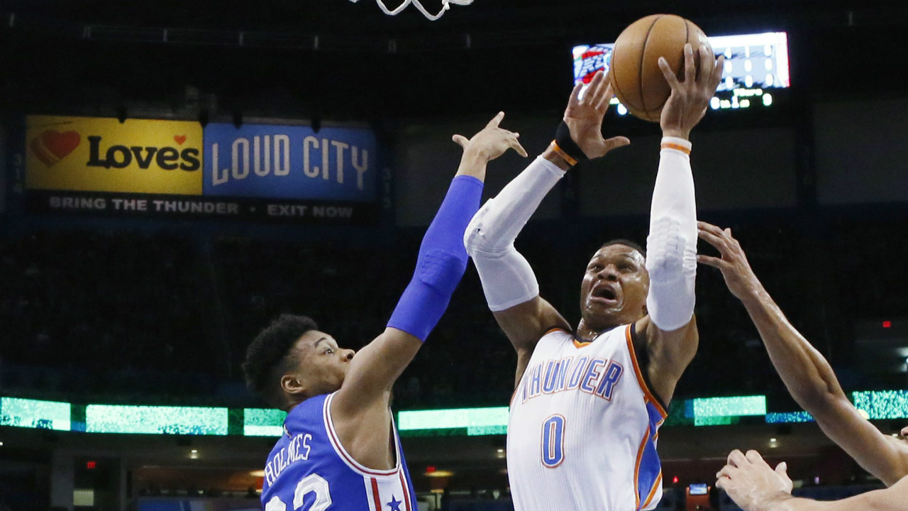 Oklahoma-City-Thunder-guard-Russell-Westbrook-(0)-shoots-in-front-of-Philadelphia-76ers-forward-Richaun-Holmes-(22)-during-the-first-quarter-of-an-NBA-basketball-game-in-Oklahoma-City,-Wednesday,-March-22,-2017.-(Sue-Ogrocki/AP)