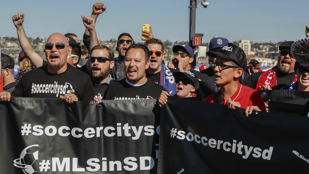 Soccer-fans-cheer-and-rally-before-a-Major-League-Soccer-press-conference-on-the-USS-Midway-Museum-in-San-Diego,-Calif.-(Eduardo-Contreras/The-San-Diego-Union-Tribune-via-AP)