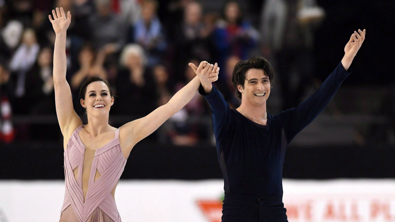 Tessa-Virtue-and-Scott-Moir-celebrate-as-they-finish-the-senior-ice-dance-free-dance-to-take-gold-at-the-National-Skating-Championships-in-Ottawa-on-Saturday,-Jan.-21,-2017.-When-Virtue-and-ice-dance-partner-Moir-returned-to-competition-after-a-two-year-hiatus,-they-decided-to-shake-things-up,-moving-to-Montreal-to-train-with-coaches-Marie-France-Dubreuil-and-Patrice-Lauzon-from-their-previous-home-in-Canton,-Mich.-(Sean-Kilpatrick/CP)