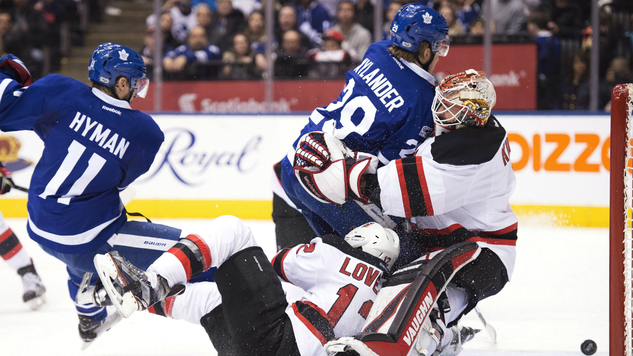 Toronto-Maple-Leafs-centre-William-Nylander-(29)-runs-into-New-Jersey-Devils-goalie-Keith-Kinkaid-(1)-as-Maple-Leafs-centre-Zach-Hyman-(11)-and-Devils-defenceman-Ben-Lovejoy-(12)-collide-during-second-period-NHL-action-in-Toronto-on-Thursday,-March-23,-2017.-(Frank-Gunn/CP)