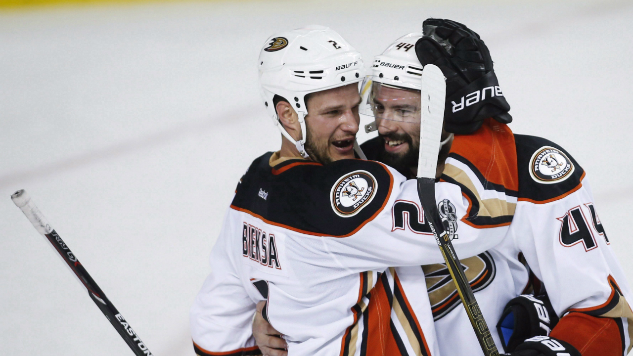 Anaheim-Ducks'-Kevin-Bieksa,-left,-and-Nate-Thompson-celebrate-after-third-period-NHL-hockey-round-one-playoff-action-against-the-Calgary-Flames,-in-Calgary,-Wednesday,-April-19,-2017.-The-Ducks-ended-the-Flames'-playoff-hopes-with-a-3-1-win.-(Jeff-McIntosh/CP)