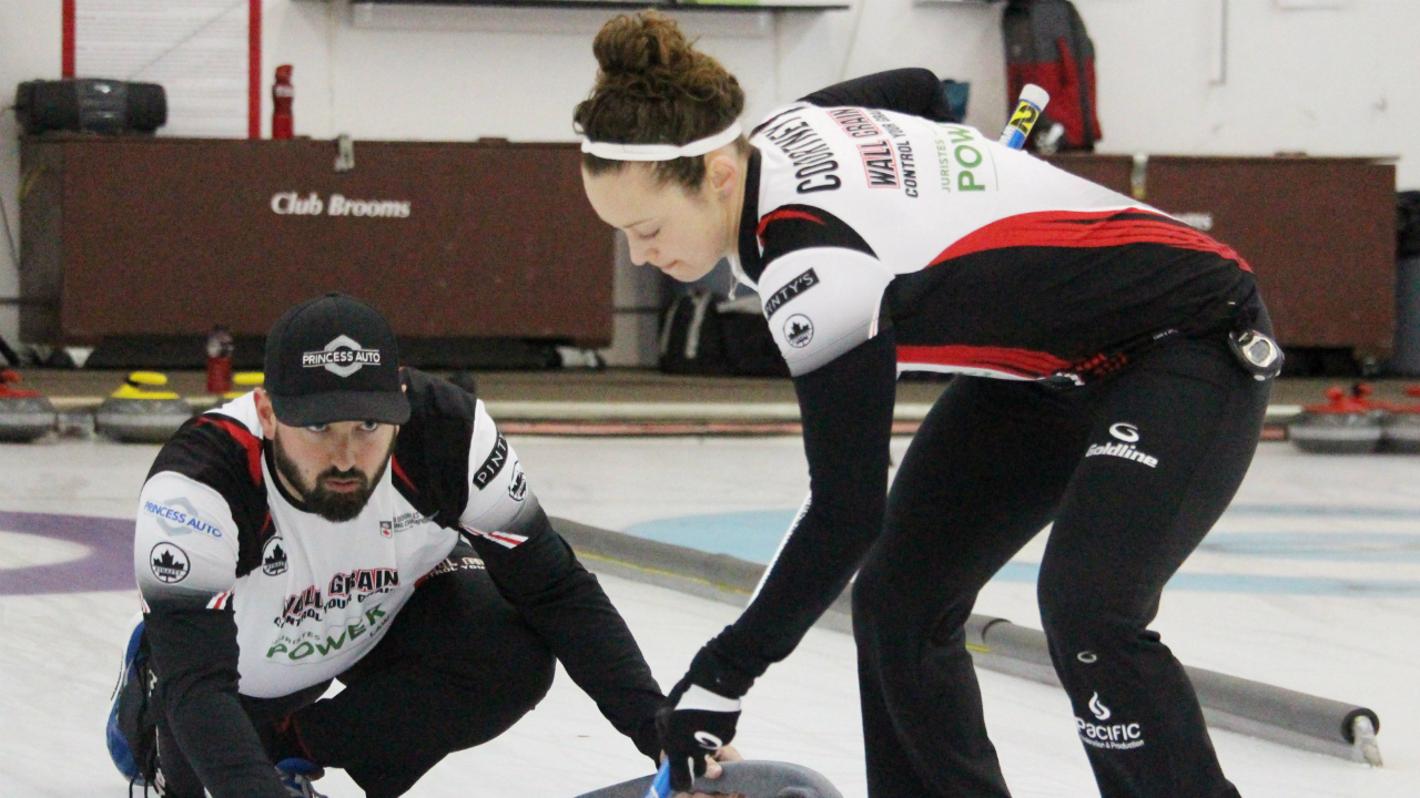 Reid-Carruthers-throws-as-Joanne-Courtney-sweeps-at-the-Canadian-Mixed-Doubles-Curling-Championships-in-Saskatoon,-Sask.-on-Saturday,-April-8,-2017-in-this-handout-photo.-(Curling-Canada---Darlene-Danyliw,-via-CP)
