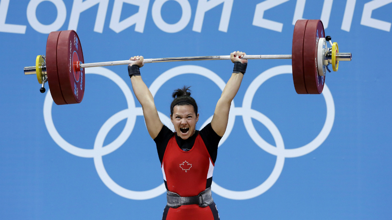 Christine-Girard-of-Canada-competes-during-the-women's-63-kg,-group-A,-weightlifting-competition-at-the-2012-Summer-Olympics,-Tuesday,-July-31,-2012,-in-London.-Girard-won-the-bronze-medal.-(Hassan-Ammar/AP)