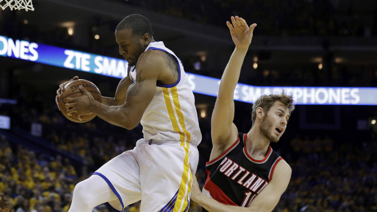 Golden-State-Warriors'-Andre-Iguodala,-left,-grabs-a-rebound-next-to-Portland-Trail-Blazers'-Jake-Layman-during-the-second-half-in-Game-2-of-a-first-round-NBA-basketball-playoff-series-Wednesday,-April-19,-2017,-in-Oakland,-Calif.-(Marcio-Jose-Sanchez/AP)