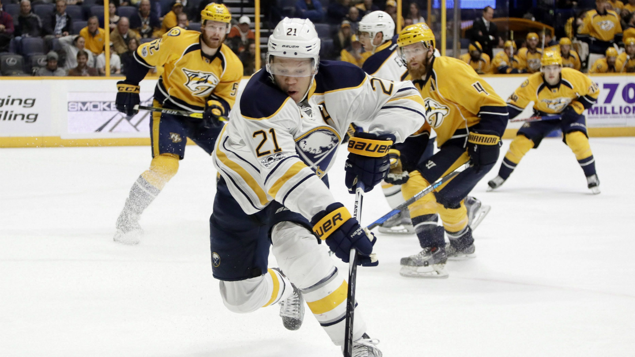 Buffalo-Sabres-right-wing-Kyle-Okposo-(21)-moves-the-puck-against-the-Nashville-Predators-during-the-first-period-of-an-NHL-hockey-game,-Tuesday,-Jan.-24,-2017,-in-Nashville,-Tenn.-(Mark-Humphrey/AP)