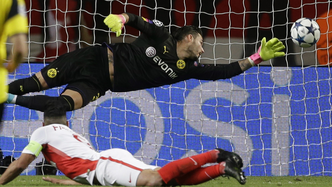 Monaco's-Radamel-Falcao,-below,-heads-the-ball-to-score-the-team's-second-goal-during-the-Champions-League-quarterfinal-second-leg-soccer-match-between-Monaco-and-Dortmund-at-the-Louis-II-stadium-in-Monaco,-Wednesday-April-19,-2017.-(Claude-Paris/AP)
