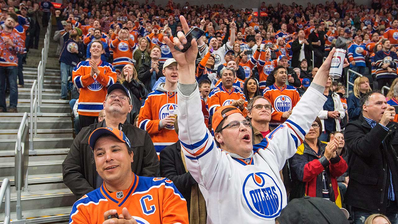 Oilers fans takes a beating in the stand at the Rogers Arena