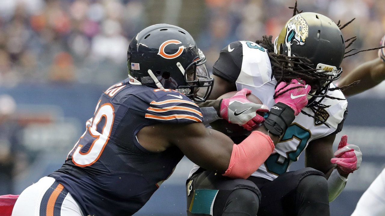 Chicago-Bears-outside-linebacker-Sam-Acho-(49)-tackles-Jacksonville-Jaguars-running-back-Chris-Ivory-(33)-during-the-first-half-of-an-NFL-football-game-in-Chicago,-Sunday,-Oct.-16,-2016.-(Jeff-Roberson/AP)