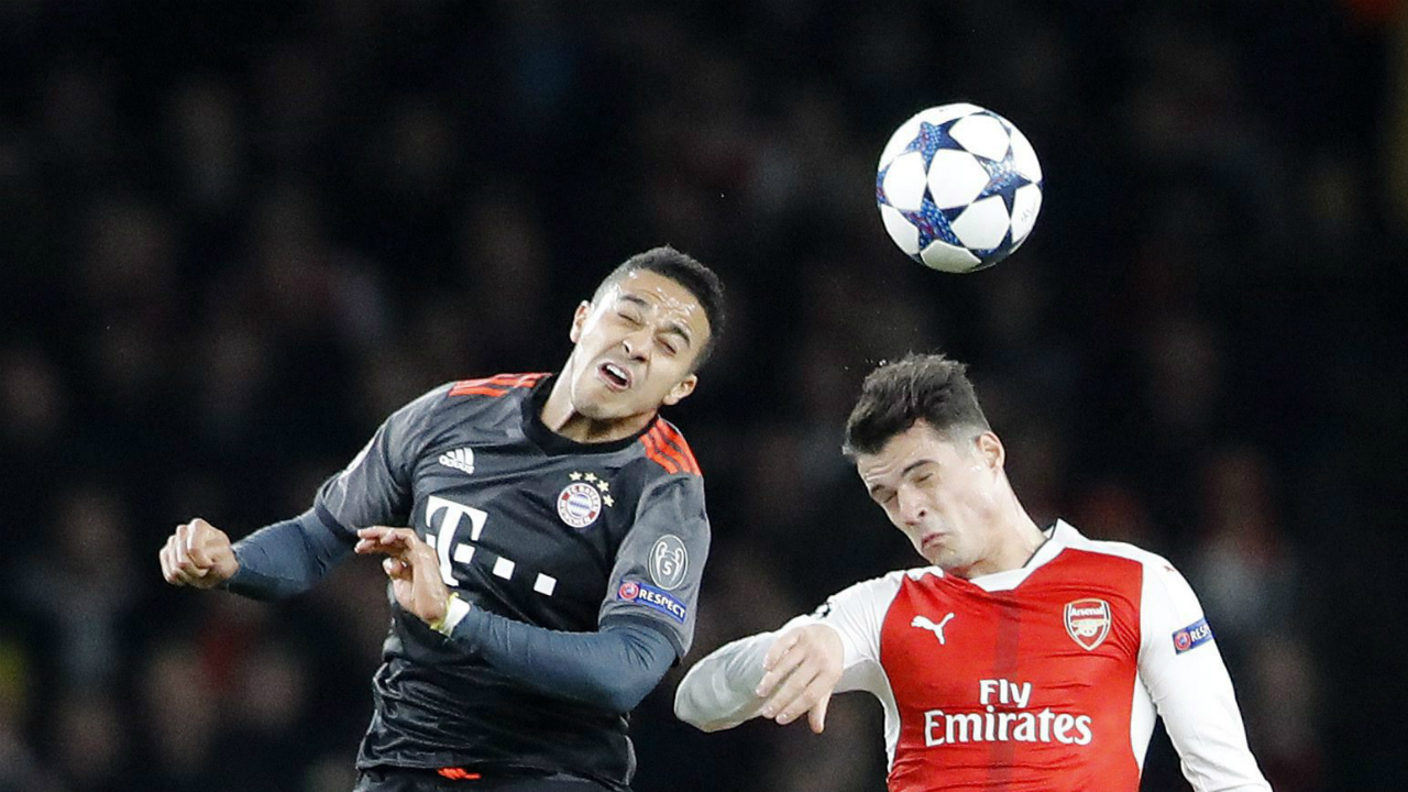 Bayern's-Thiago-Alcantara,-left,-is-challenged-by-Arsenal's-Granit-Xhaka-during-the-Champions-League-round-of-16-second-leg-soccer-match-between-Arsenal-and-Bayern-Munich-at-the-Emirates-Stadium-in-London,-Tuesday,-March-7,-2017.-(Frank-Augstein/AP)