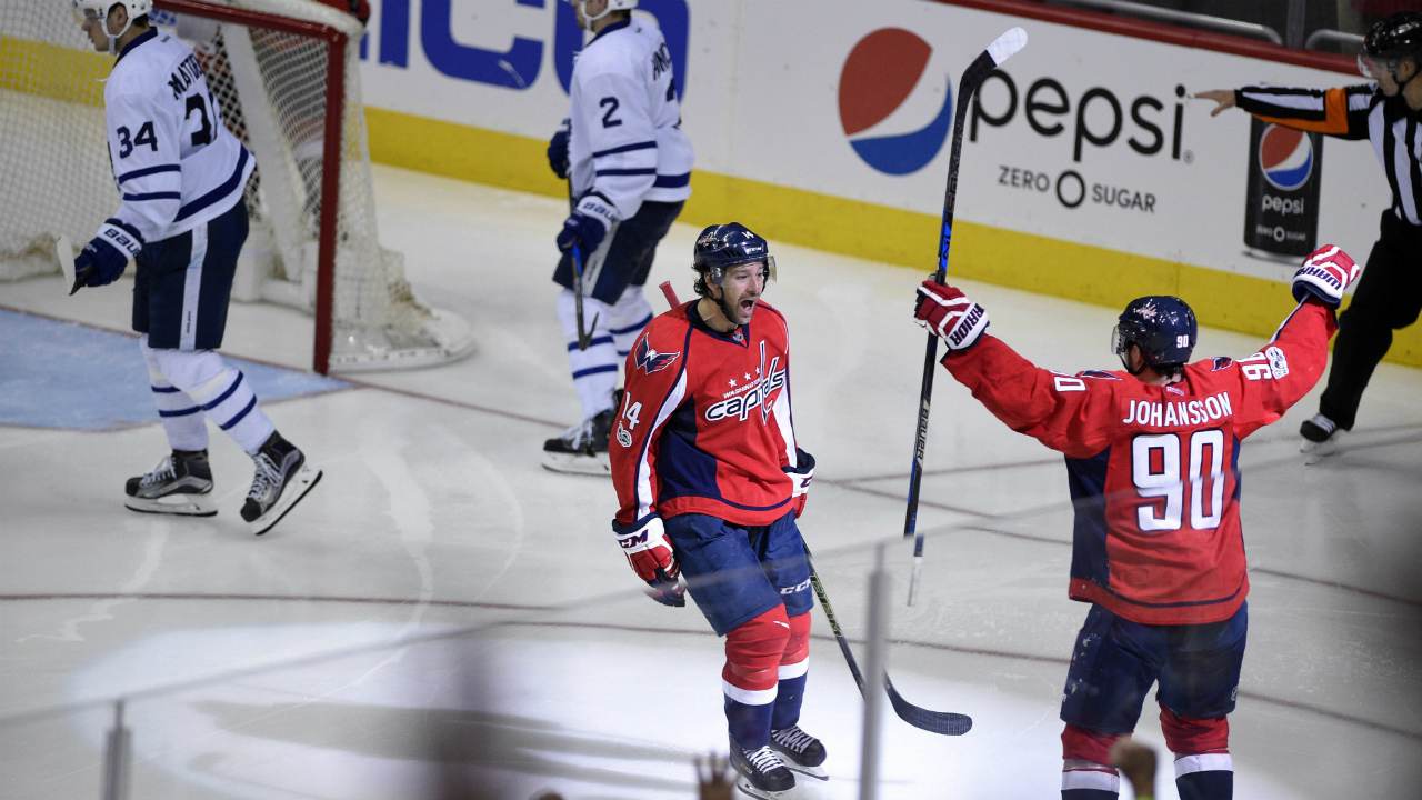 Washington-Capitals-right-wing-Justin-Williams-(14)-celebrates-his-winning-goal-with-Marcus-Johansson-(90),-of-Sweden,-in-the-overtime-of-Game-5-in-an-NHL-Stanley-Cup-hockey-first-round-playoff-series-as-Toronto-Maple-Leafs-center-Auston-Matthews-(34)-and-defenseman-Matt-Hunwick-(2)-skate-away,-Friday,-April-21,-2017,-in-Washington.-(Nick-Wass/AP)