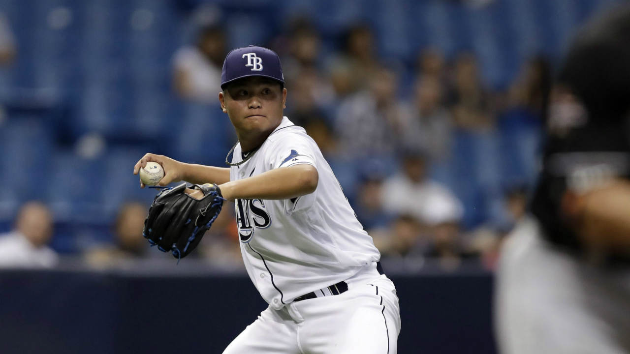 Tampa-Bay-Rays-relief-pitcher-Chih-Wei-Hu,-of-Taiwan,-left,-throws-out-Miami-Marlins'-Derek-Dietrich-at-first-during-the-eighth-inning-of-a-baseball-game-Thursday,-May-4,-2017,-in-St.-Petersburg,-Fla.-(Chris-O'Meara/AP)