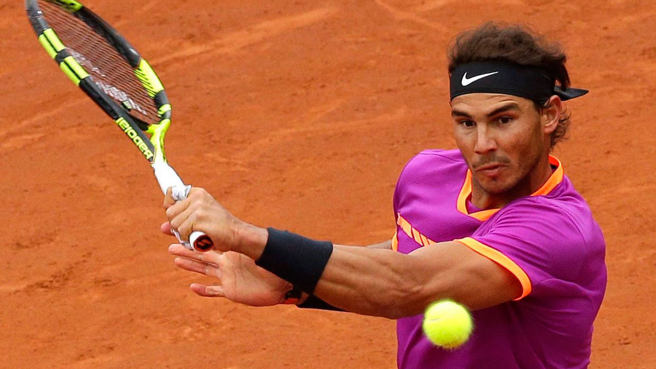 Rafael Nadal of Spain returns the ball. (Manu Fernandez/AP Photo)