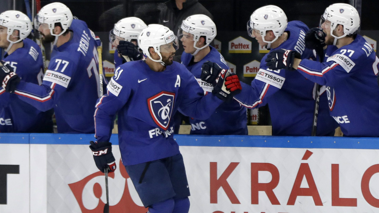 France's-Pierre-Edouard-Bellemare-celebrates-with-teammates-after-scoring-during-the-Ice-Hockey-World-Championships-group-B-match-between-France-and-Finland-in-the-AccorHotels-Arena-in-Paris,-France,-Sunday,-May-7,-2017.-(Petr-David-Josek/AP)