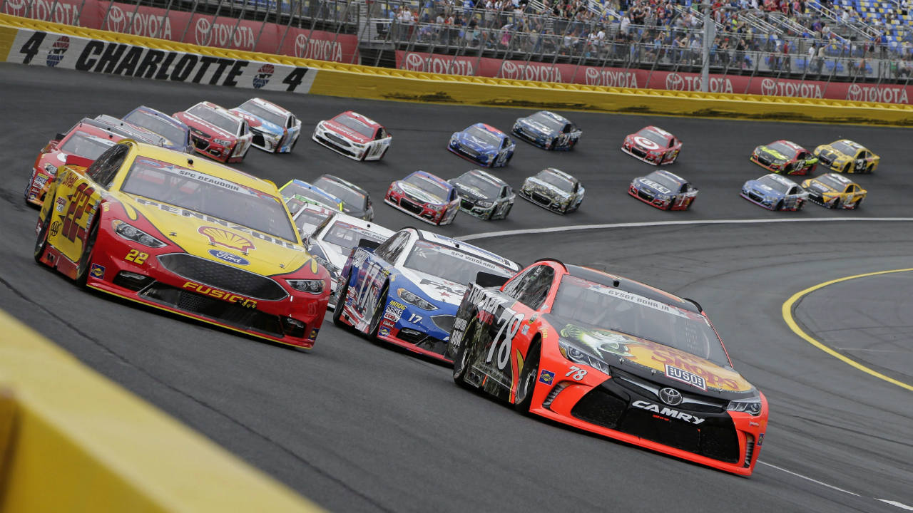 In-this-May-29,-2016,-file-photo,-Martin-Truex-Jr-(78)-and-Joey-Logano-(22)-lead-the-field-out-of-Turn-4-for-the-start-of-the-Coca-Cola-600-NASCAR-auto-race-at-Charlotte-Motor-Speedway-in-Concord,-N.C.-(Chuck-Burton/AP)