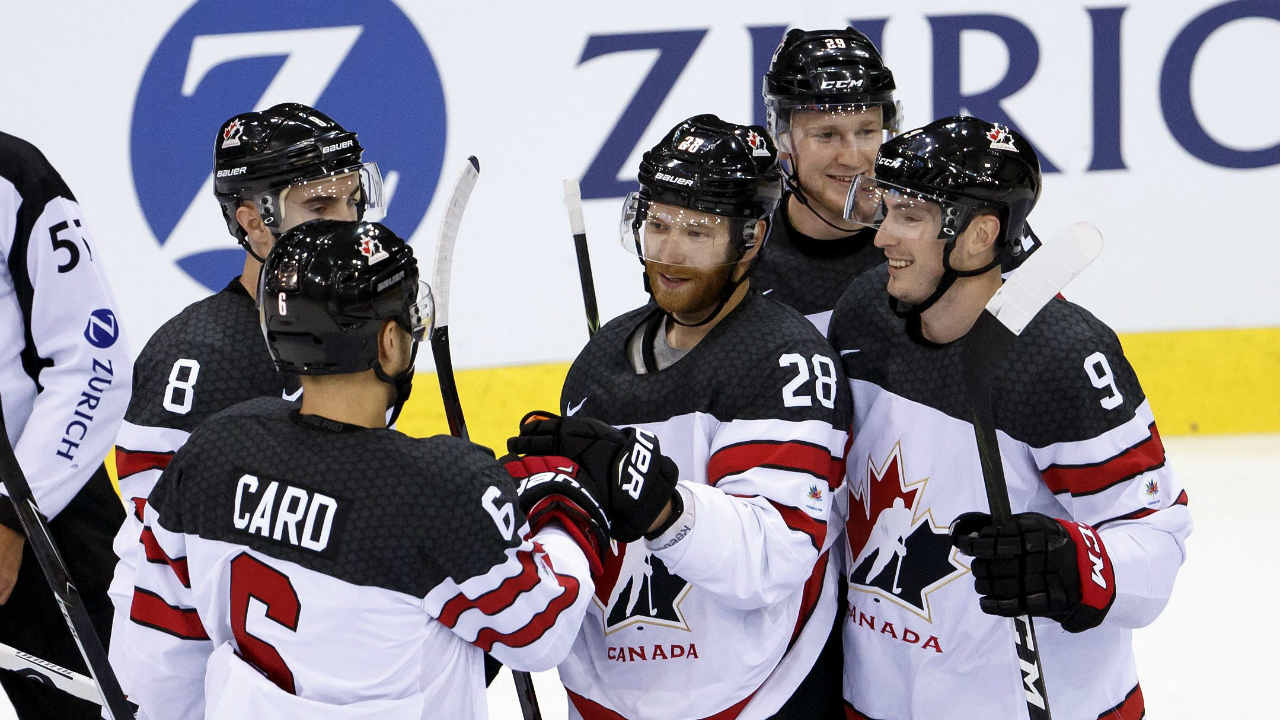 Canada's-forward-Claude-Giroux-#28-celebrates-his-goal-with-teammates-defender-Chris-Lee,-left,-forward-Nathan-MacKinnon,-2nd-right,-and-forward-Matt-Duchene,-during-a-friendly-international-ice-hockey-game-between-Switzerland-and-Canada,-at-the-ice-stadium-Les-Vernets,-in-Geneva,-Switzerland,-Tuesday,-May-2,-2017.-(Salvatore-Di-Nolfi/Keystone-via-AP)