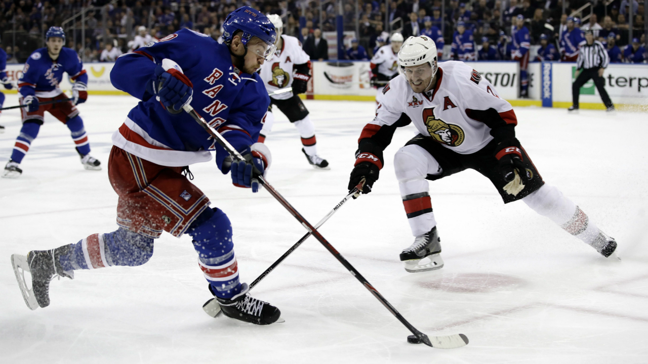 New-York-Rangers'-Michael-Grabner-(40)-looks-to-control-the-puck-in-front-of-Ottawa-Senators'-Dion-Phaneuf-(2)-during-the-second-period-of-Game-3-of-an-NHL-hockey-Stanley-Cup-second-round-playoff-series-Tuesday,-May-2,-2017,-in-New-York.-The-Rangers-won-4-1.-(Frank-Franklin-II/AP)