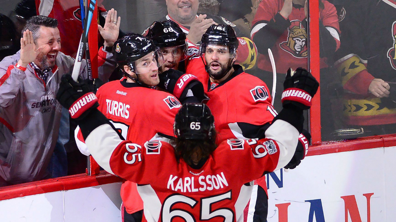 Ottawa-Senators-left-wing-Mike-Hoffman-(68)-celebrates-with-centre-Kyle-Turris-(7)-left-wing-Clarke-MacArthur-(16)-and-defenceman-Erik-Karlsson-(65)-as-New-York-Rangers-goalie-Henrik-Lundqvist-(30)-looks-on-during-the-second-period-in-game-five-of-a-second-round-NHL-hockey-Stanley-Cup-playoff-series-in-Ottawa-on-Saturday,-May-6,-2017.-(Sean-Kilpatrick/CP)