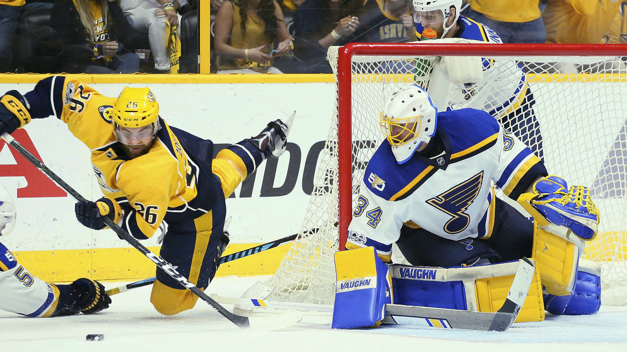 Nashville-Predators-left-wing-Harry-Zolnierczyk-(26)-tries-to-shoot-as-he-is-tripped-by-St.-Louis-Blues-left-wing-Magnus-Paajarvi-in-the-second-period-in-Game-4-of-a-second-round-NHL-hockey-playoff-series,-Tuesday,-May-2,-2017,-in-Nashville,-Tenn.-(Chris-Lee/St.-Louis-Post-Dispatch-via-AP)