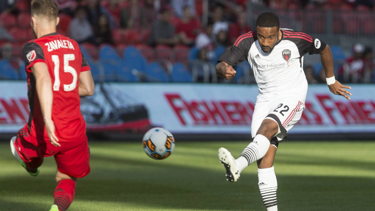 Ottawa-Fury's-Jamar-Dixon-(right)-takes-a-shot-on-goal-as-Toronto-FC-forward-Eriq-Zavaleta-tries-to-block-his-shot-during-first-half-Canadian-Championship-semifinal-second-leg-action-in-Toronto-on-Wednesday,-May-31,-2017.-(Chris-Young/CP)