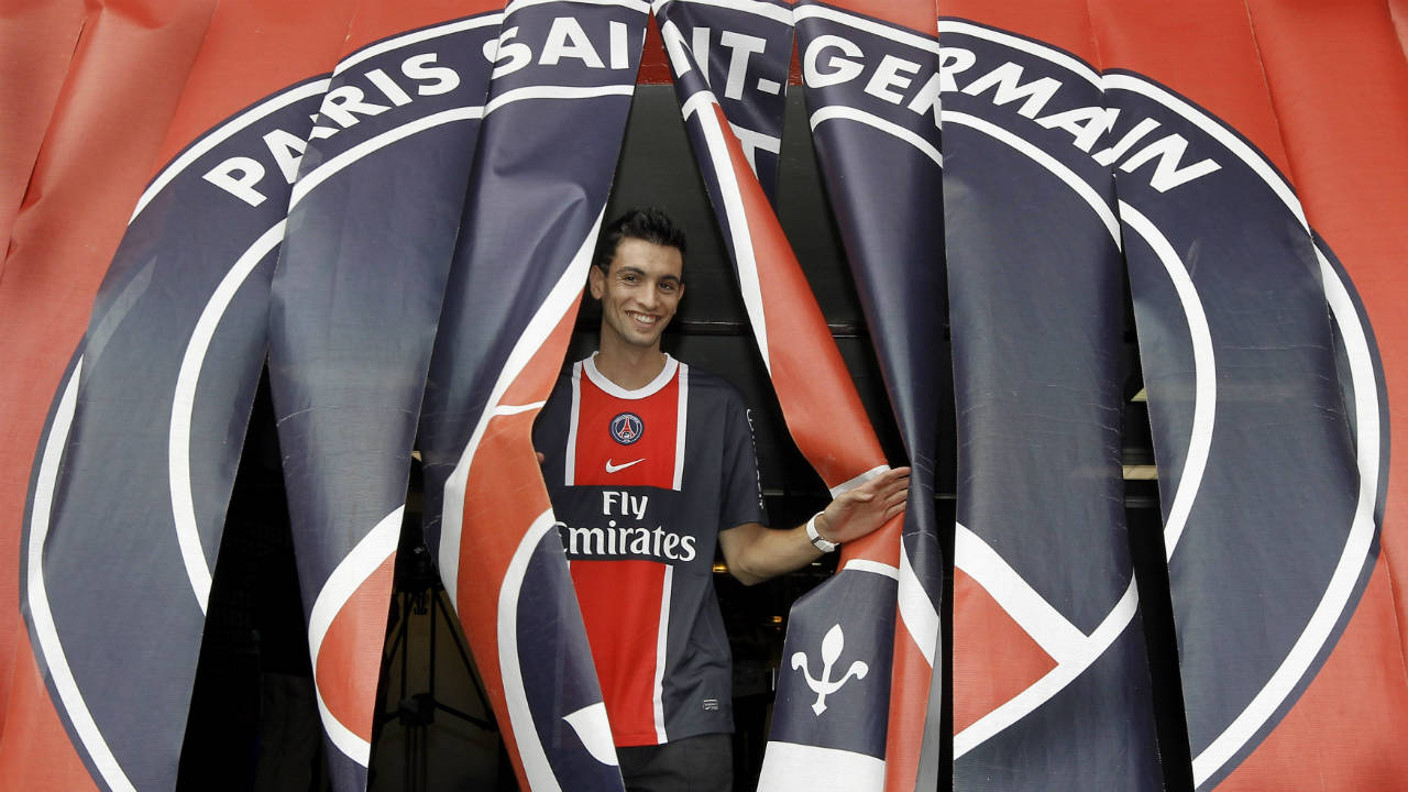 In-this-Monday,-Aug.-8,-2011-file-picture,-Javier-Pastore-poses-while-wearing-his-new-PSG-jersey-during-his-official-presentation-at-the-Parc-des-Princes-stadium-in-Paris,-France.-A-French-official-says-police-investigating-suspected-tax-fraud-linked-to-the-soccer-industry-have-raided-the-headquarters-of-Paris-Saint-Germain-and-the-homes-of-three-Argentine-players-in-France.-The-official-said-anti-corruption-police-units-searched-the-homes-of-PSG-players-Angel-Di-Maria-and-Javier-Pastore,-and-that-of-Nantes-forward-Emiliano-Sala-on-Tuesday.-(Jacques-Brinon,-File/AP)