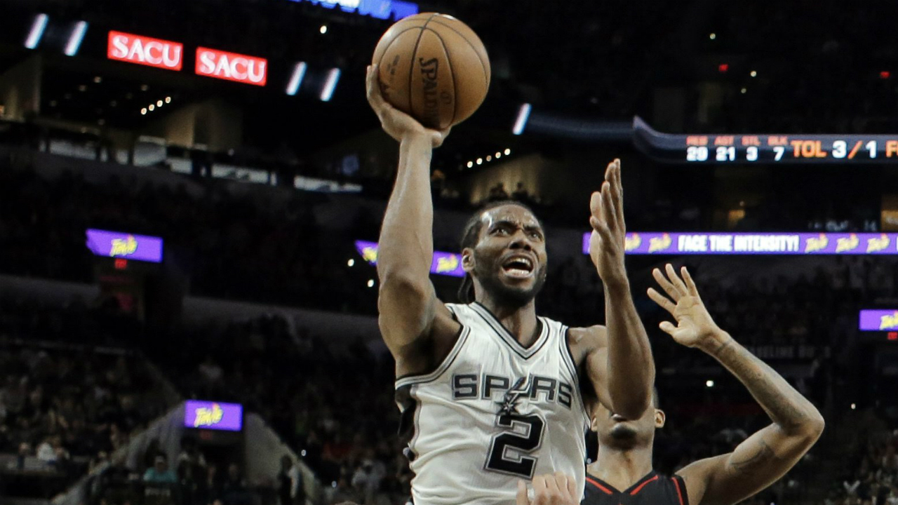 San-Antonio-Spurs-forward-Kawhi-Leonard-(2)-takes-a-shot-over-Houston-Rockets'-Ryan-Anderson-(3)-as-Trevor-Ariza-(1)-defends-during-the-second-half-of-Game-2-in-a-second-round-NBA-basketball-playoff-series,-Wednesday,-May-3,-2017,-in-San-Antonio.-(Eric-Gay/AP)