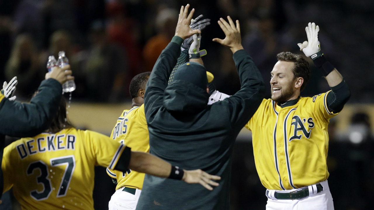 Oakland-Athletics'-Jed-Lowrie,-right,-celebrates-after-hitting-a-walk-off-home-run-off-Los-Angeles-Angels'-Deolis-Guerra-in-the-eleventh-inning-of-a-baseball-game-Monday,-May-8,-2017,-in-Oakland,-Calif.-(Ben-Margot/AP)