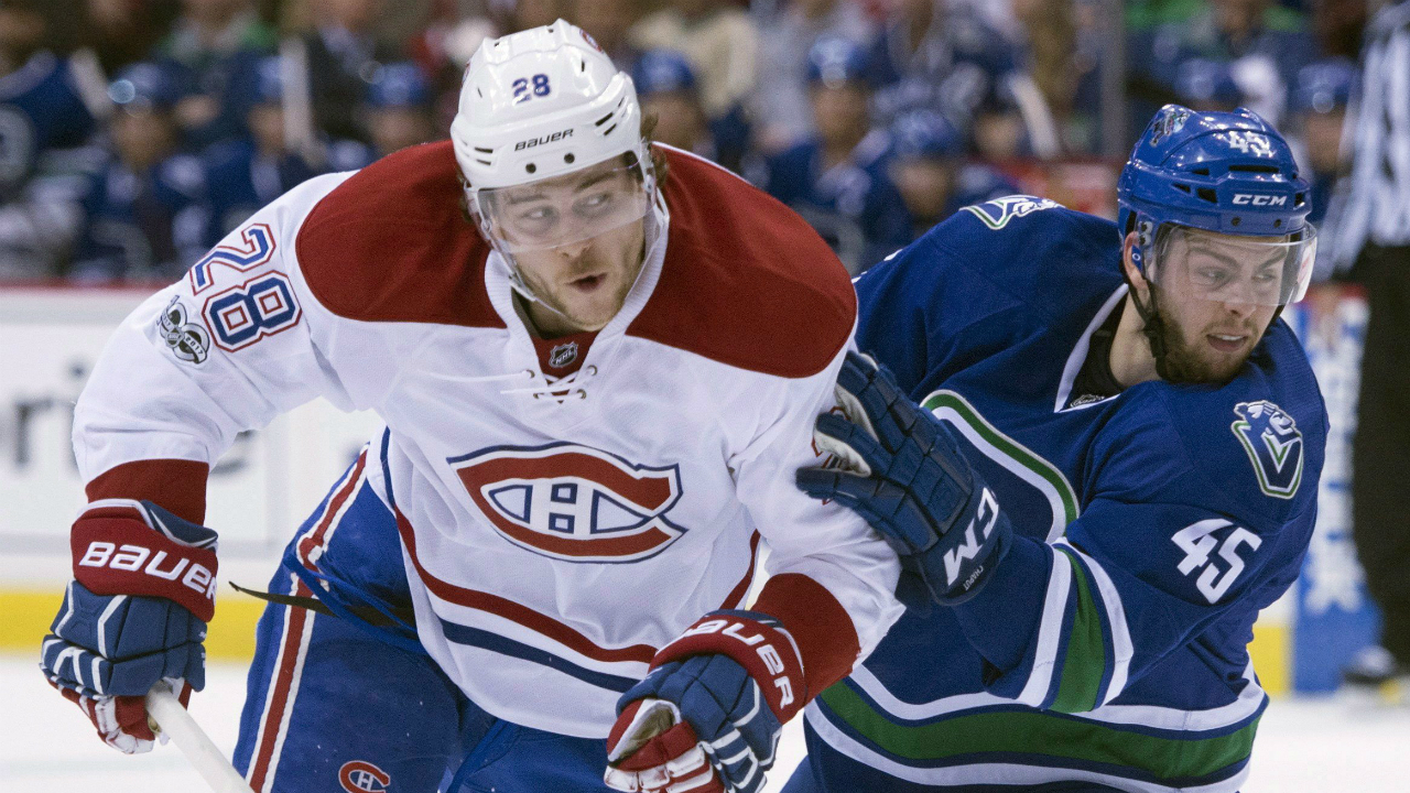 Vancouver-Canucks-centre-Michael-Chaput-(45)-fights-for-control-of-the-puck-with-Montreal-Canadiens-defenceman-Nathan-Beaulieu-(28)-during-first-period-NHL-action-in-Vancouver,-B.C.,-Tuesday,-March-7,-2017.-(Jonathan-Hayward/CP)