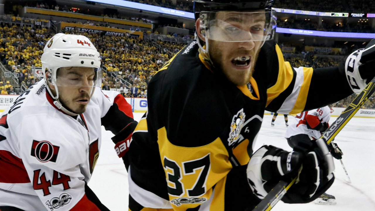 Pittsburgh-Penguins'-Carter-Rowney-(37)-and-Ottawa-Senators'-Jean-Gabriel-Pageau-(44)-battle-along-the-boards-during-the-second-period-of-Game-1-of-the-Eastern-Conference-final-in-the-NHL-hockey-Stanley-Cup-playoffs,-Saturday,-May-13,-2017,-in-Pittsburgh.-(Gene-J.-Puskar/AP)