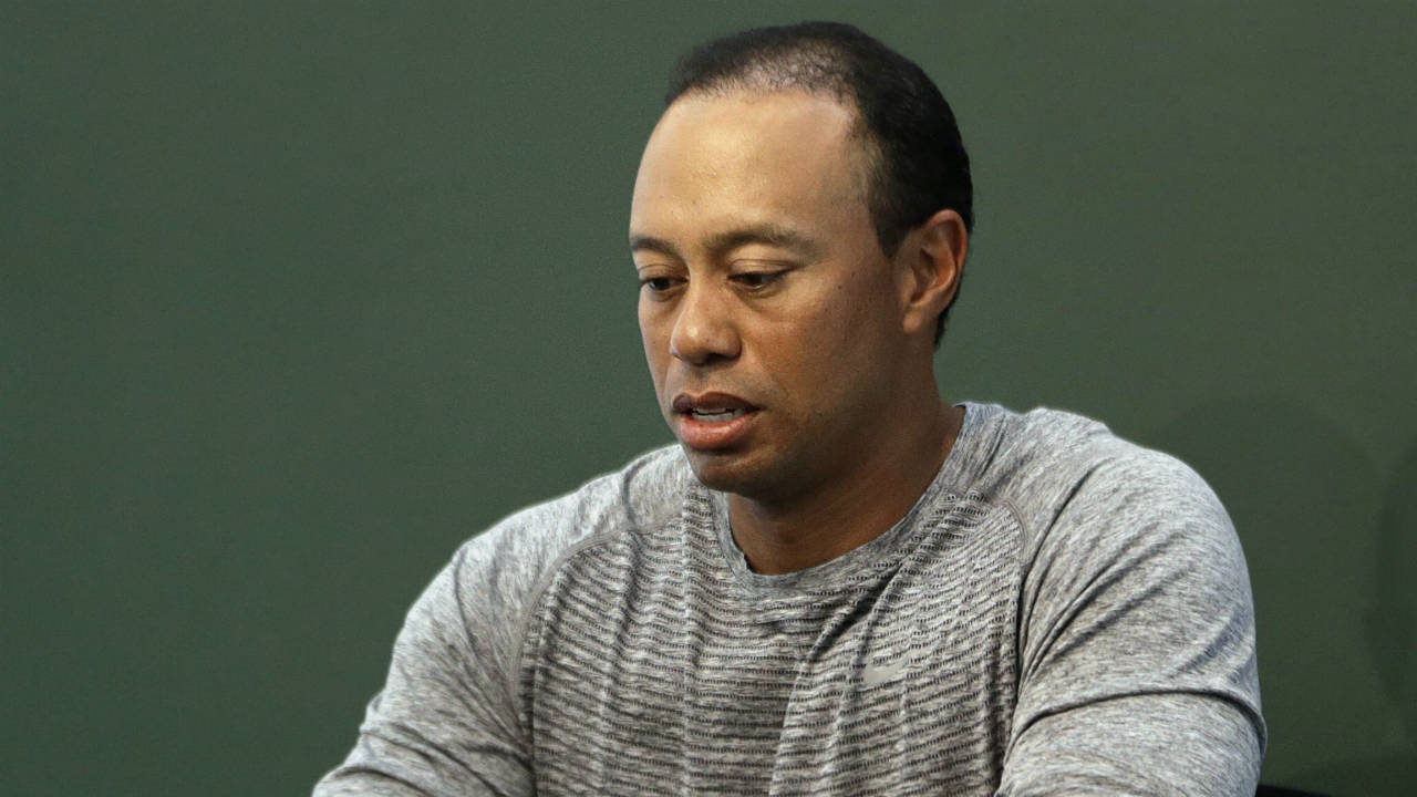 In-this-March-20,-2017,-file-photo,-golfer-Tiger-Woods-prepares-to-sign-copies-of-his-new-book-at-a-book-signing-in-New-York.-Police-say-golf-great-Tiger-Woods-has-been-arrested-on-a-DUI-charge-in-Florida.-The-Palm-Beach-County-Sheriff's-Office-says-on-its-website-that-Woods-was-booked-into-a-county-jail-around-7-a.m.-on-Monday,-May-29,-2017.-(Seth-Wenig/AP)
