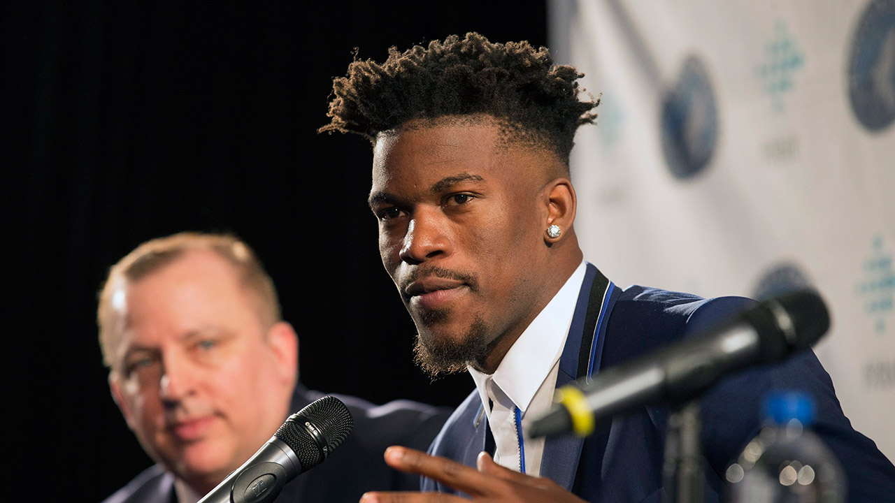 Jimmy-Butler-gestures-as-he-speaks-as-Minnesota-Timberwolves-head-coach-Tom-Thibodeau,-left,-looks-on-during-an-introductory-press-conference-in-Bloomington,-Minn.,-Thursday,-June-29,-2017.-(Jerry-Holt/AP)