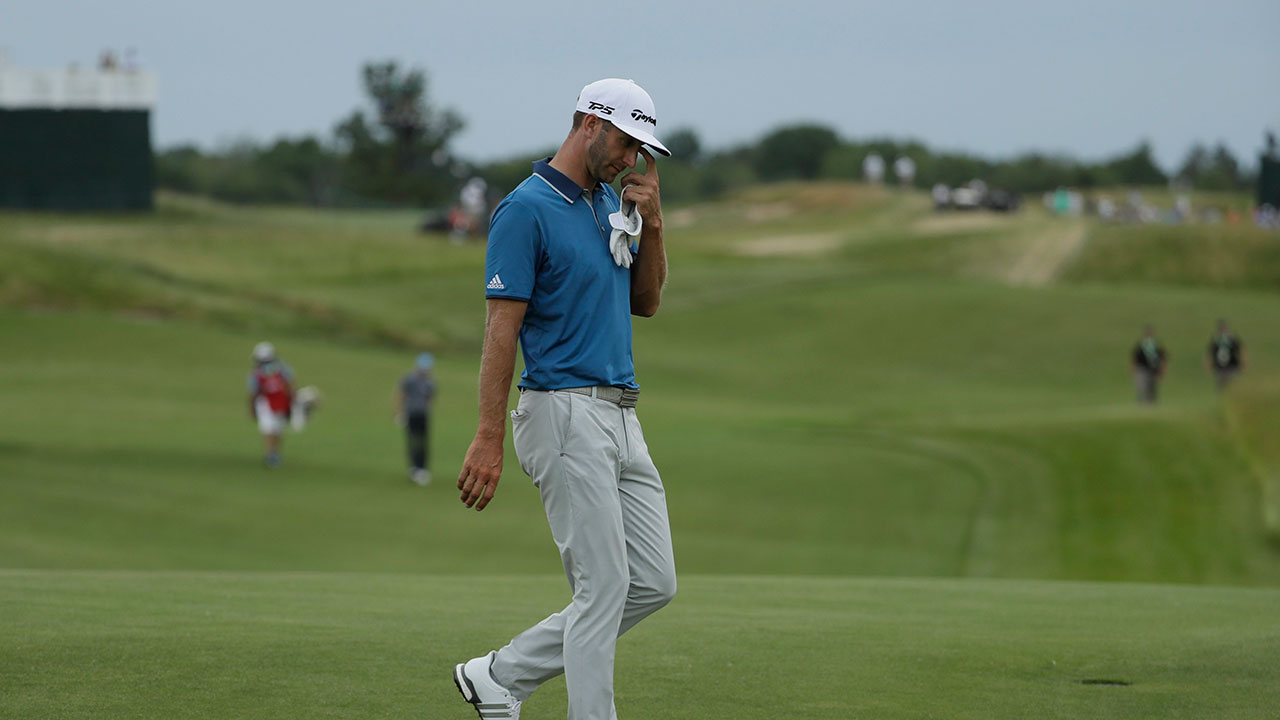 Dustin-Johnson-walks-to-the-18th-green-during-the-second-round-of-the-U.S.-Open-golf-tournament-Friday,-June-16,-2017,-at-Erin-Hills-in-Erin,-Wis.-(David-J.-Phillip/AP)