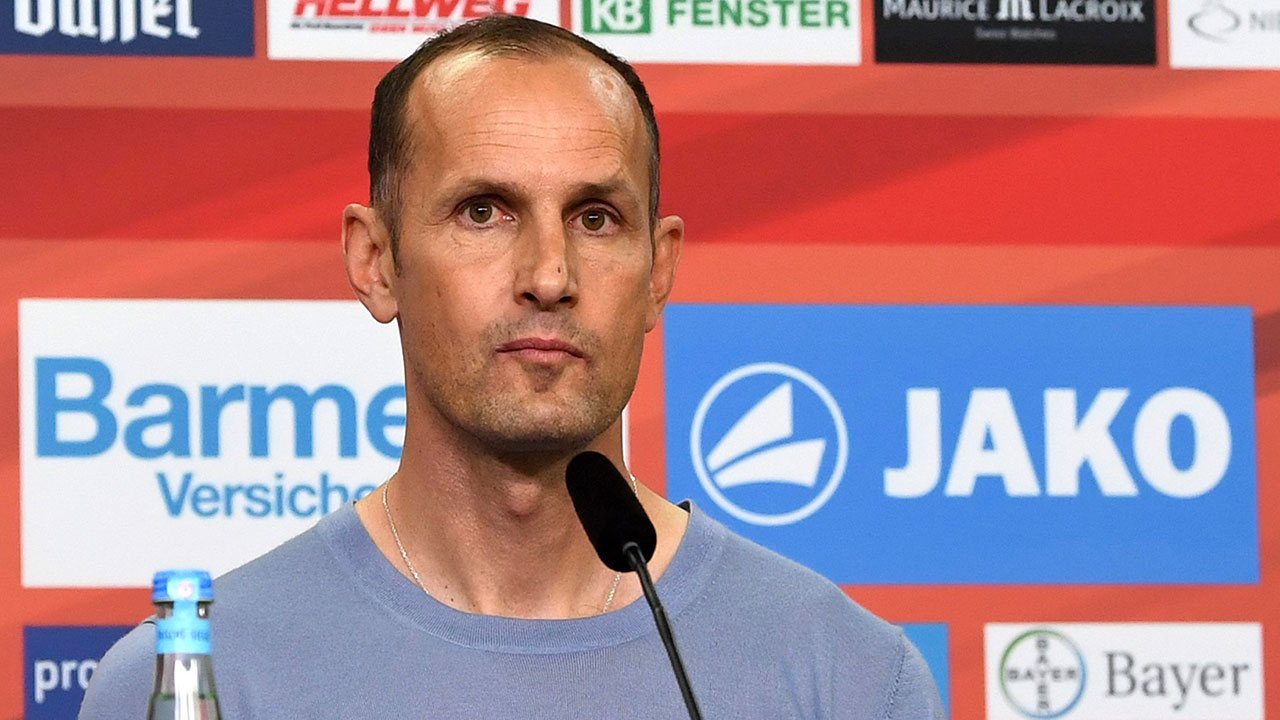 New-Bayer-Leverkusen-coach,,-Heiko-Herrlich,-attends-a-news-conference-in-Leverkusen,-Germany,-Friday,-June-9,-2017.-The-Bundesliga-club-says-the-45-year-old-Herrlich,-has-signed-a-two-year-deal.-[Federico-Gambarini/dpa/AP]
