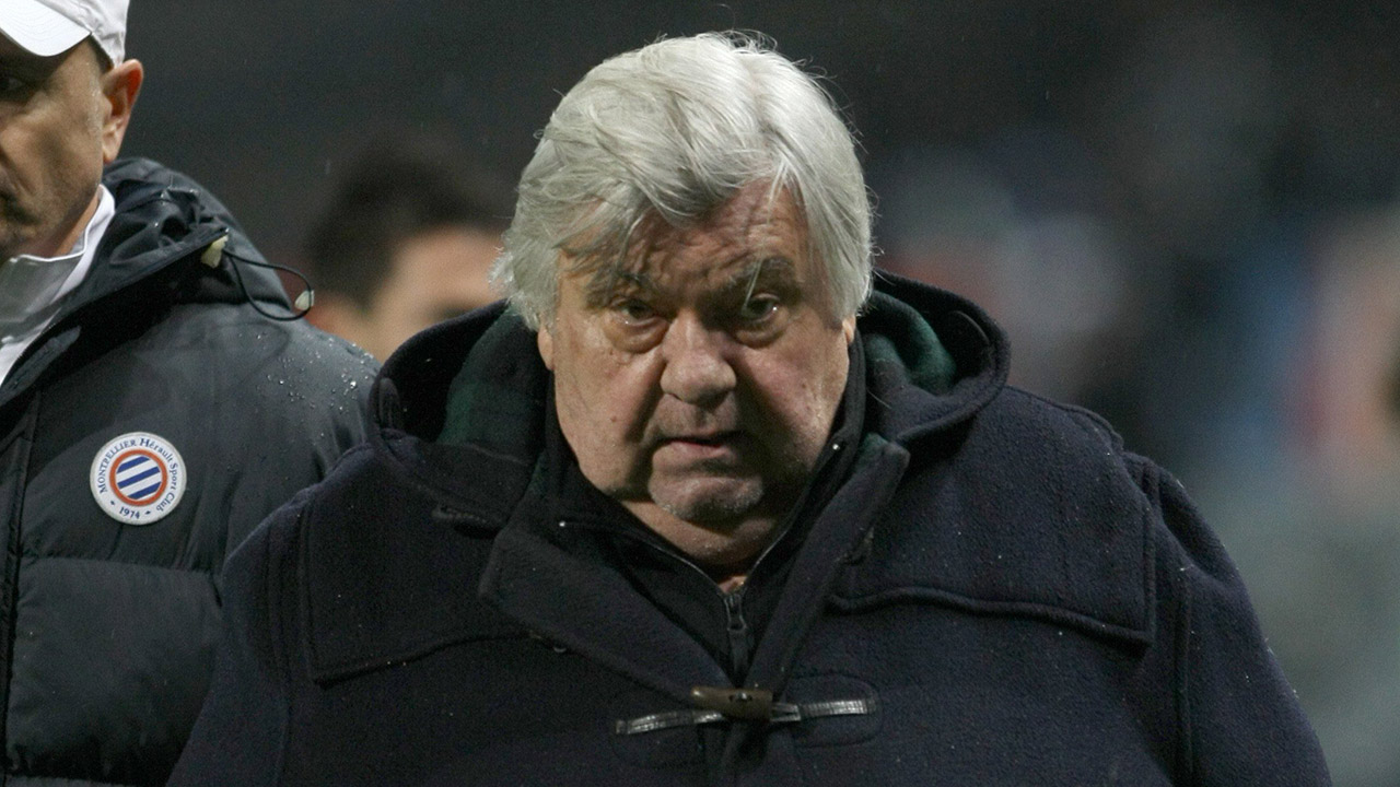 Montpellier's-President-Louis-Nicollin-leaves-the-field-at-the-end-of-the-League-One-soccer-match,-against-Marseille,-at-the-Velodrome-Stadium,-in-Marseille,-southern-France,-Saturday,-Nov.-27,-2010.-Marseille-won-4-0.-(Claude-Paris/AP)