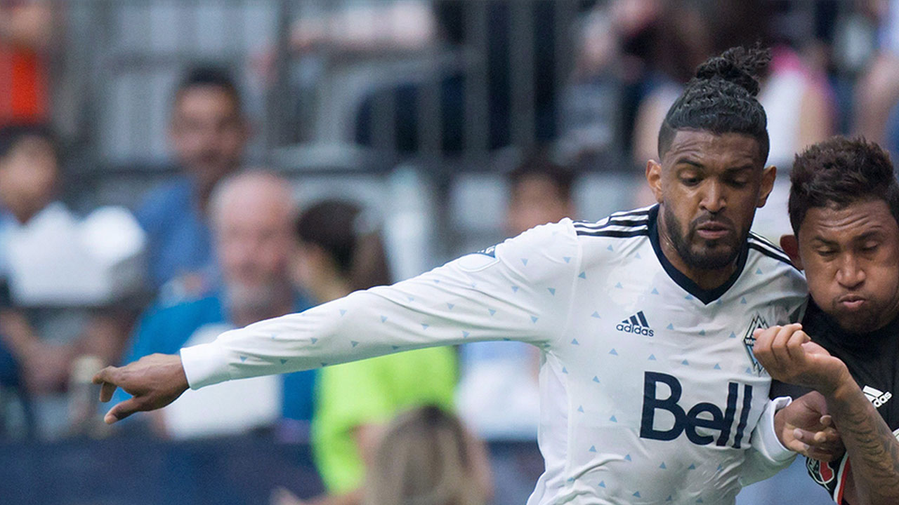 D.C.-United's-Jose-Guillermo-Ortiz,-centre,-attempts-to-move-the-ball-past-Vancouver-Whitecaps'-Sheanon-Williams,-left,-and-Kendall-Waston-during-the-first-half-of-an-MLS-soccer-game-in-Vancouver,-B.C.,-on-Saturday-May-27,-2017.-(Darryl-Dyck/CP)