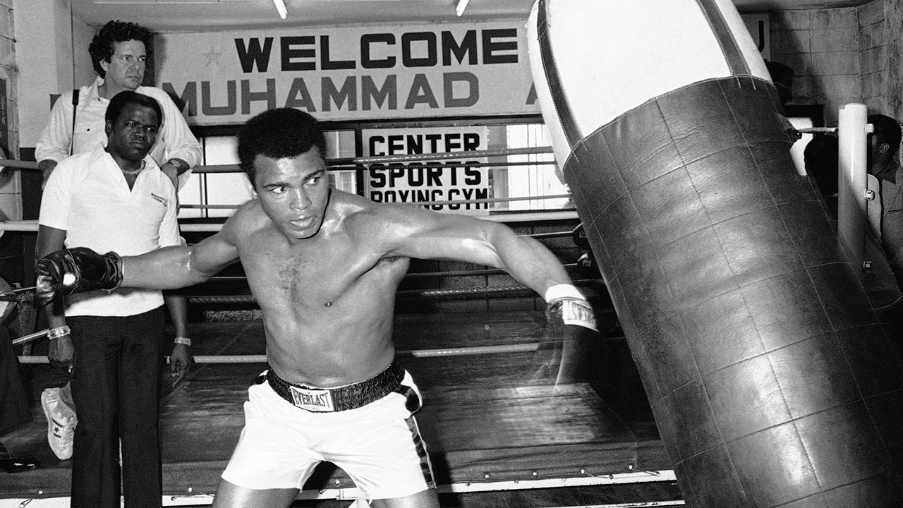 Muhammad Ali throws a punch at a sandbag during workout at a gym in Tokyo. Later in the week, the heavyweight boxing champion met Japanese pro wrestler Antonio Inoki in the world's Martial Arts Championship. (Nick Ut/AP)