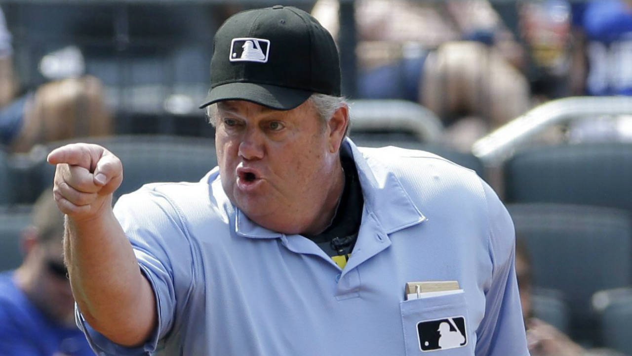 Home-plate-umpire-Joe-West-warns-New-York-Mets-hitting-coach-Kevin-Long-who-was-arguing-balls-and-strikes-from-the-dugout-after-a-Curtis-Granderson-strikeout-in-an-interleague-baseball-game-against-the-Boston-Red-Sox-in-New-York,-Sunday,-Aug.-30,-2015,-in-New-York.-West-ejected-Long-from-the-game.-(Kathy-Willens/AP)